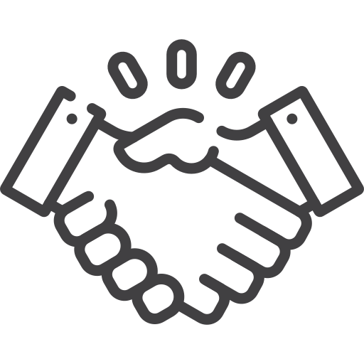 Two hands engaged in a firm handshake, symbolizing agreement, partnership, or a business deal.