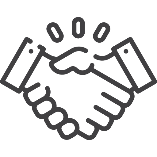 Two hands engaged in a firm handshake, symbolizing agreement, partnership, or a business deal.